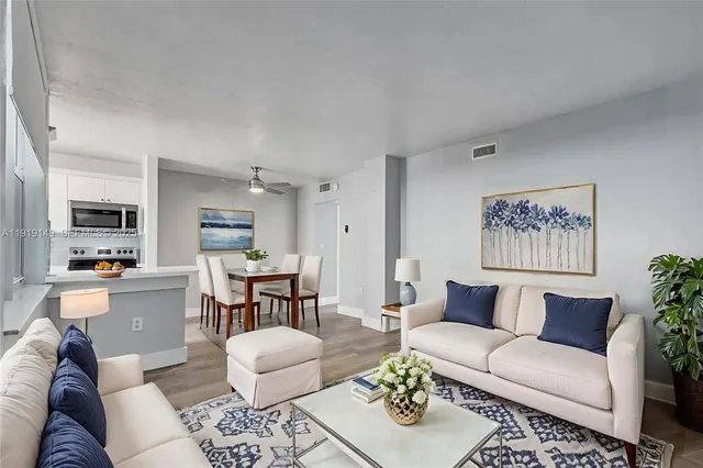 a bedroom with bed and a potted plant