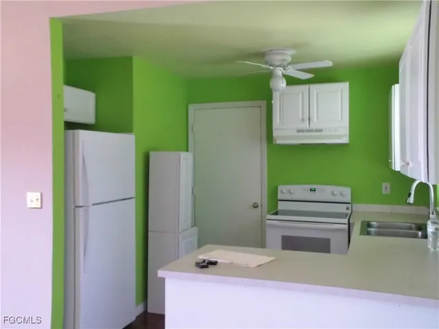 a room with a refrigerator and a table