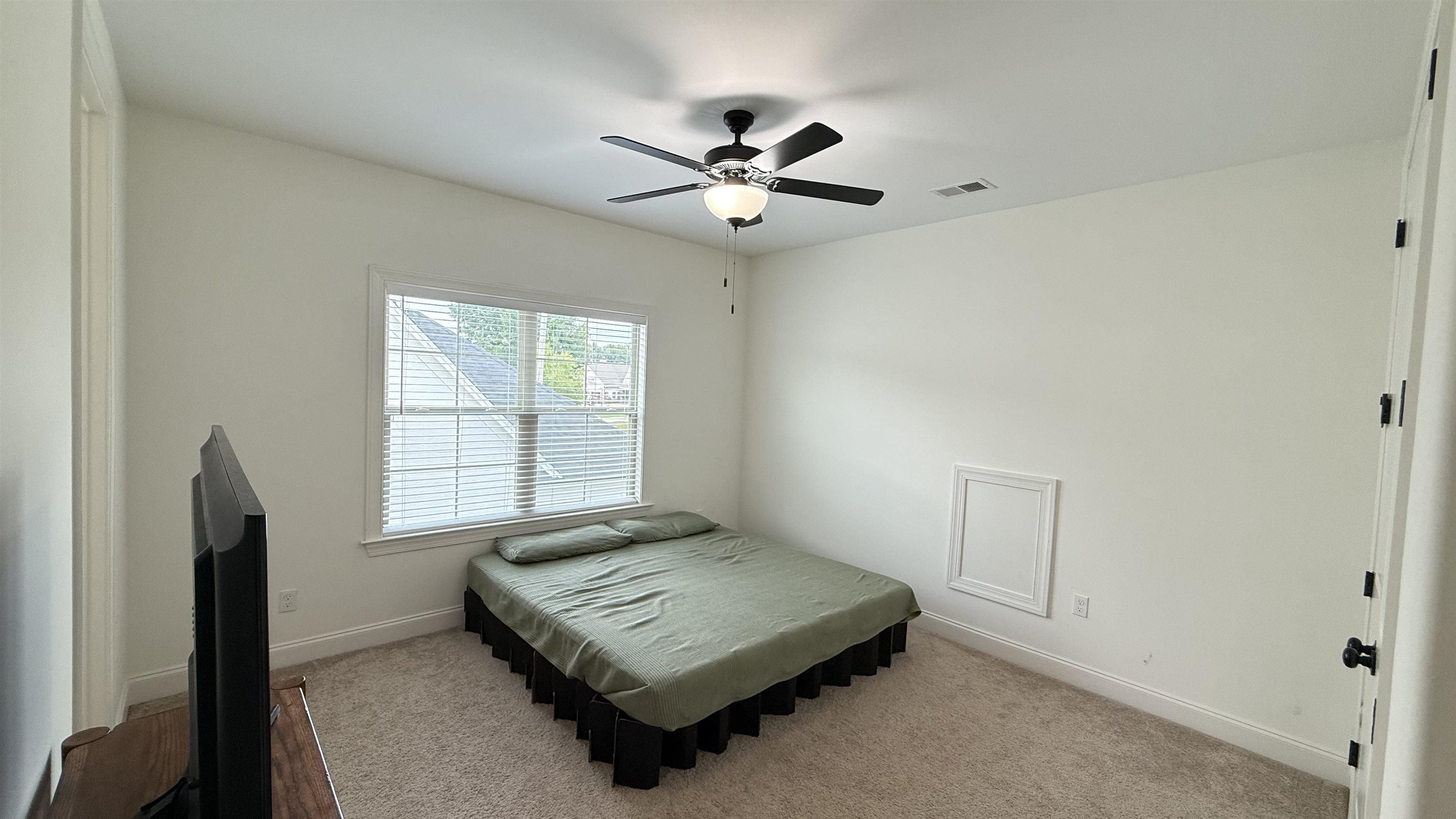 1746 Chadwick Farms Loop North Collierville, TN 38017 - Photo 26 of 35 Bedroom with carpet floors and a ceiling fan