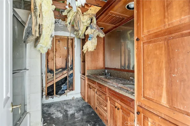 a kitchen with stainless steel appliances granite countertop a sink and stove