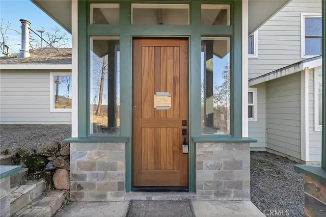 a front view of a house with a glass door