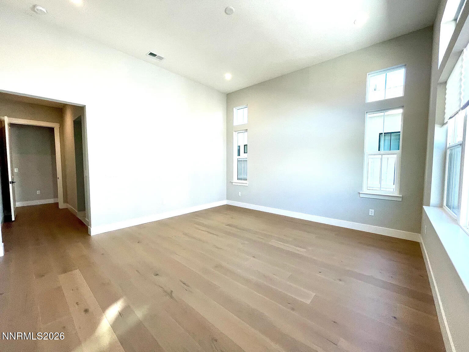 5418 Side Saddle Trail Reno, NV 89511 - Photo 14 of 37 an empty room with wooden floor and windows