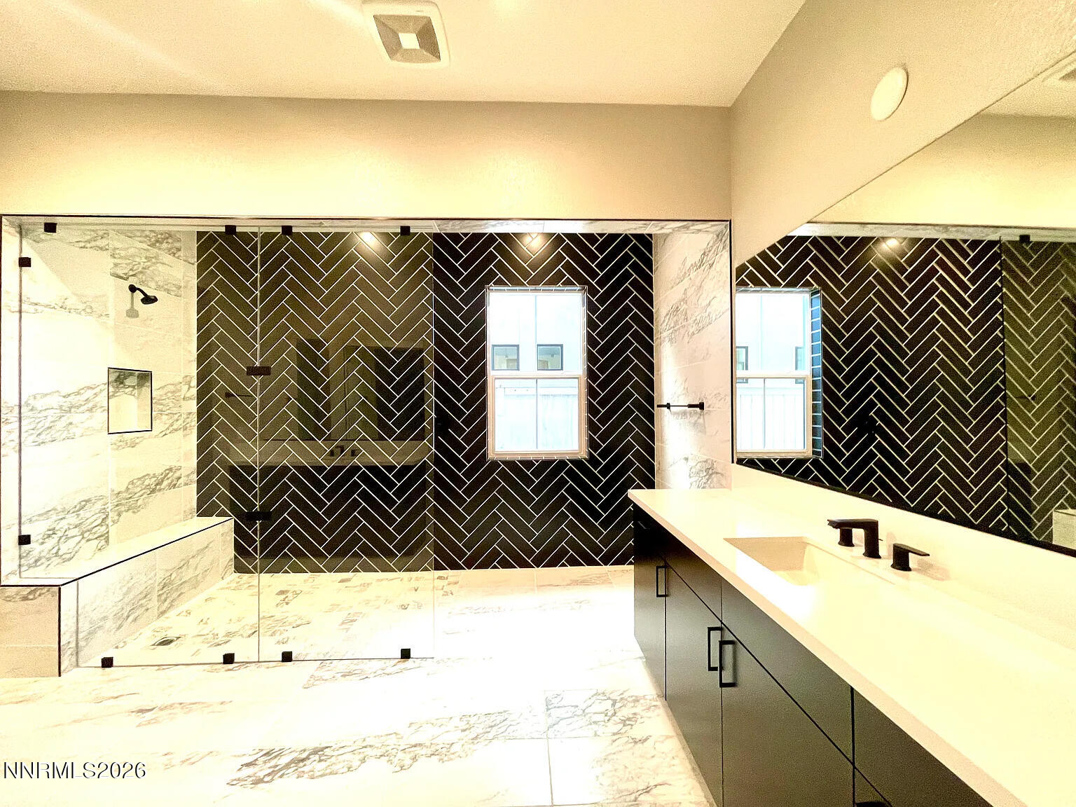 5418 Side Saddle Trail Reno, NV 89511 - Photo 22 of 37 a bathroom with a sink and a mirror