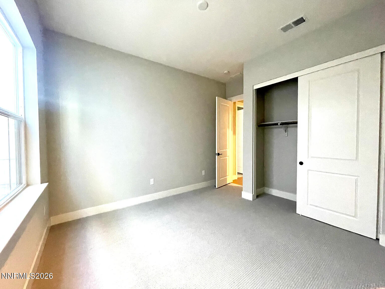 5418 Side Saddle Trail Reno, NV 89511 - Photo 30 of 37 an empty room with a window and a kitchen