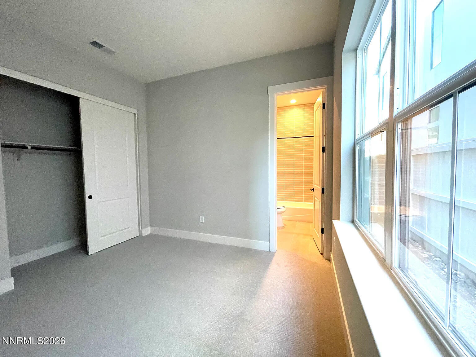 5418 Side Saddle Trail Reno, NV 89511 - Photo 31 of 37 a view of empty room with wooden floor and windows