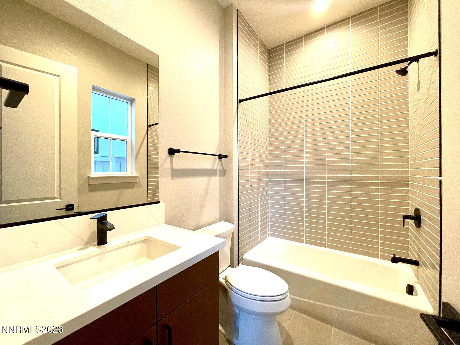 5418 Side Saddle Trail Reno, NV 89511 - Photo 32 of 37 a bathroom with a sink mirror toilet and bathtub