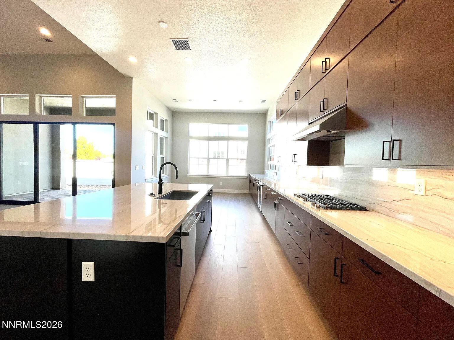 5418 Side Saddle Trail Reno, NV 89511 - Photo 8 of 37 a large kitchen with stainless steel appliances granite countertop a lot of counter space