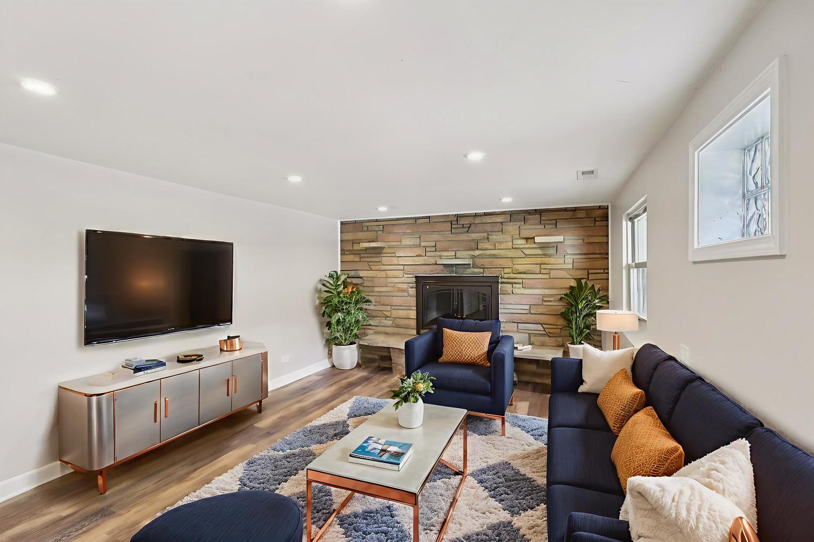 195 7th Street Wheeling, IL 60090 - Photo 21 of 34 a living room with furniture and a flat screen tv