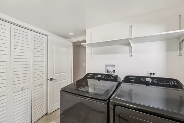 a kitchen that has a sink and cabinets