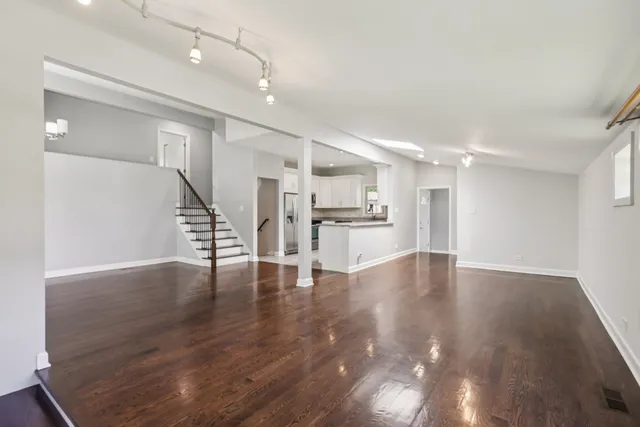 a view of kitchen with furniture and wooden floor