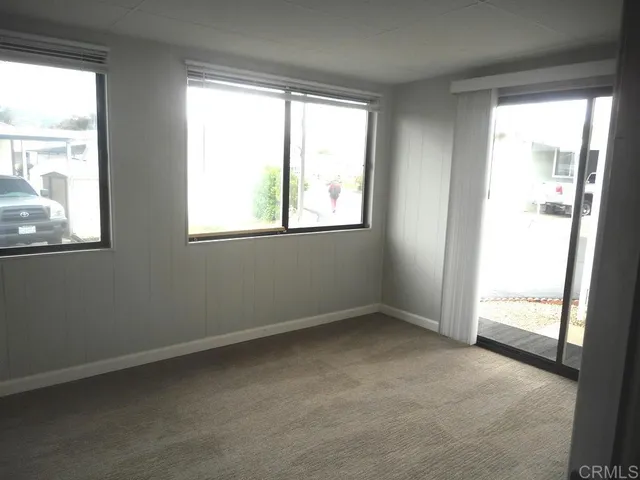 a house view with a sitting space and garden