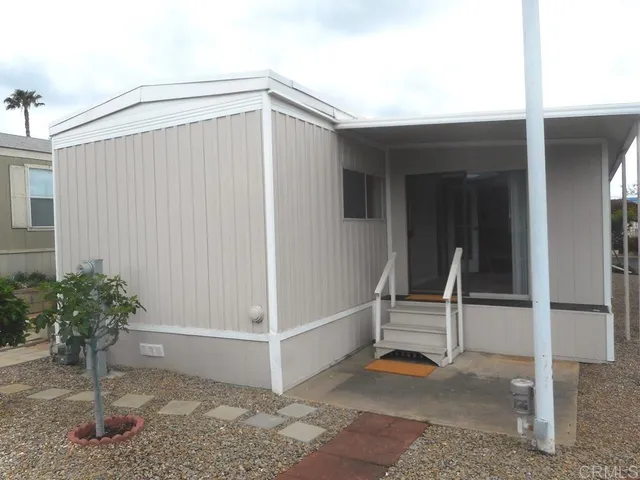 a dining room with furniture window and wooden floor