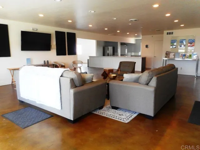 a living room with lots of furniture and window