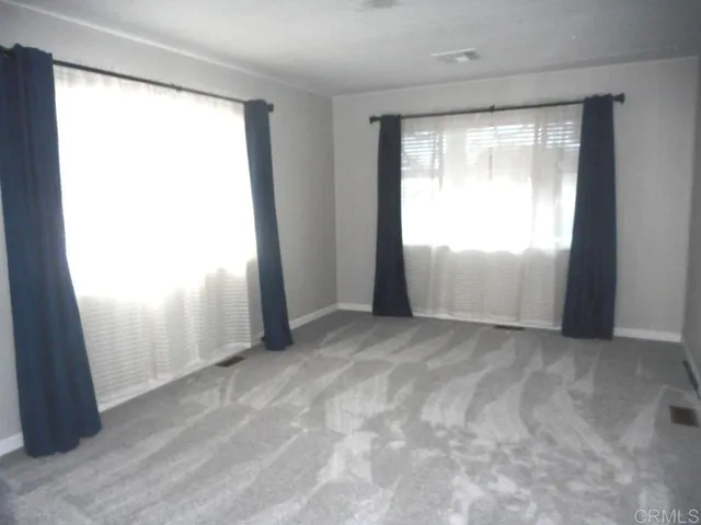 an empty room with window