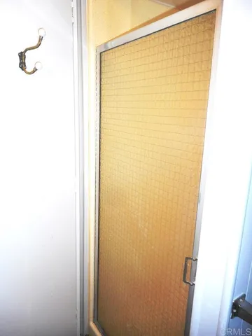 a bedroom with a bed and a cabinets