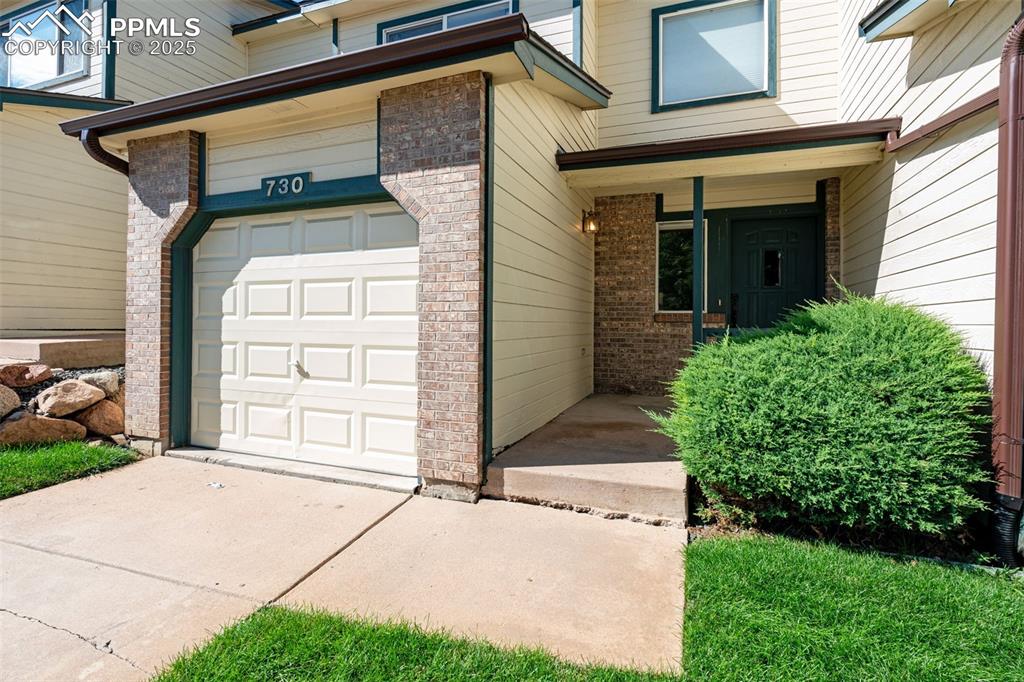 a view of a house with a small garden