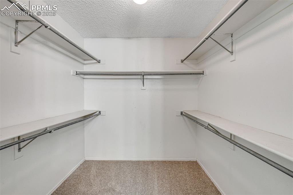 730 Mediterranean Point Colorado Springs, CO 80910 - Photo 14 of 30 a view of a room with racks on the wall