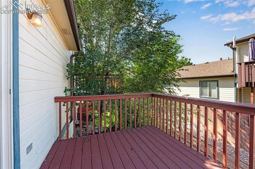730 Mediterranean Point Colorado Springs, CO 80910 - Photo 15 of 30 a balcony with wooden floor and deck