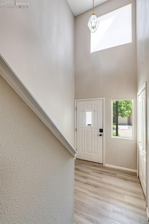 730 Mediterranean Point Colorado Springs, CO 80910 - Photo 2 of 30 a view of a livingroom with wooden floor and window