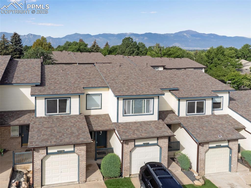 730 Mediterranean Point Colorado Springs, CO 80910 - Photo 26 of 30 a aerial view of a house with a yard and balcony
