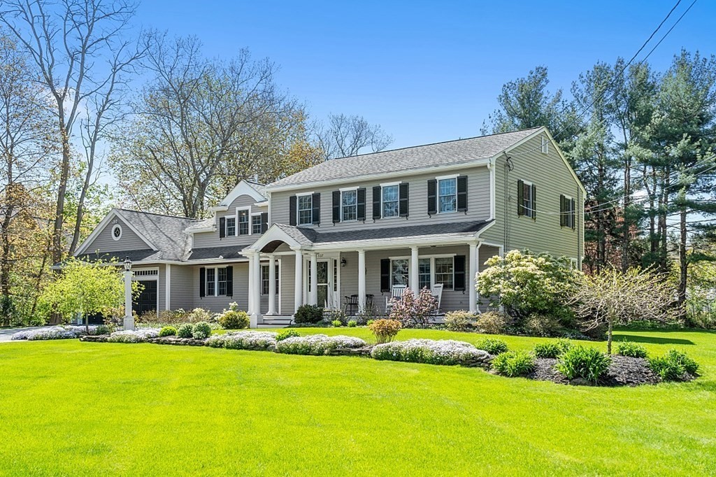 537 Barretts Mill Road Concord, MA 01742 - Photo 1 of 35 a front view of a house with a yard table and chairs