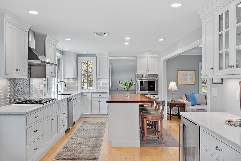537 Barretts Mill Road Concord, MA 01742 - Photo 11 of 35 a large kitchen with cabinets
