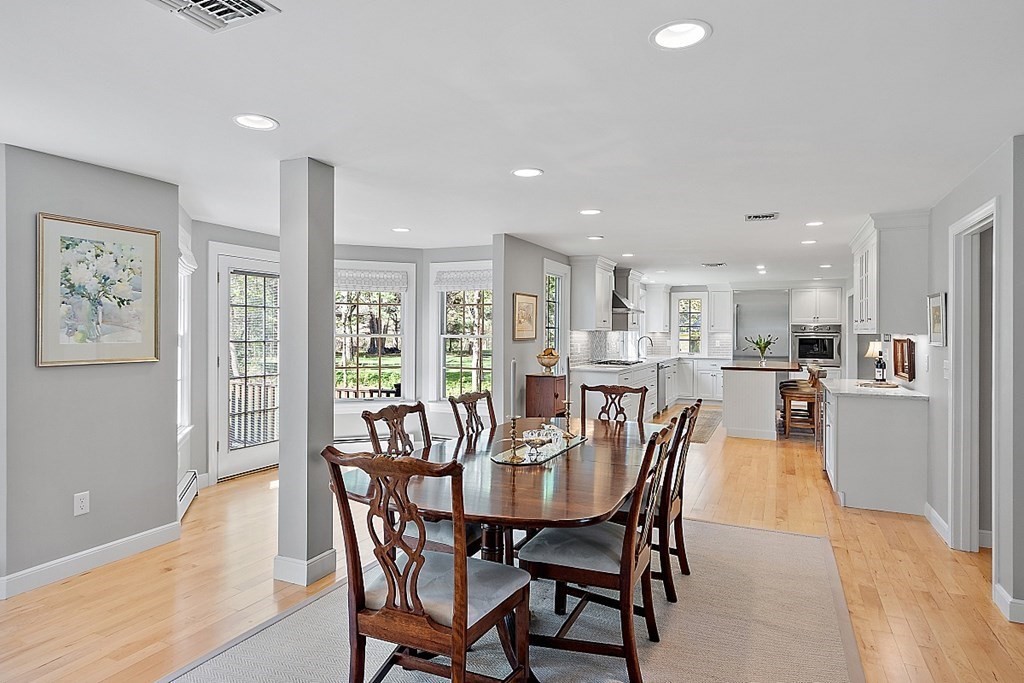 537 Barretts Mill Road Concord, MA 01742 - Photo 13 of 35 a view of a dining room with furniture and wooden floor