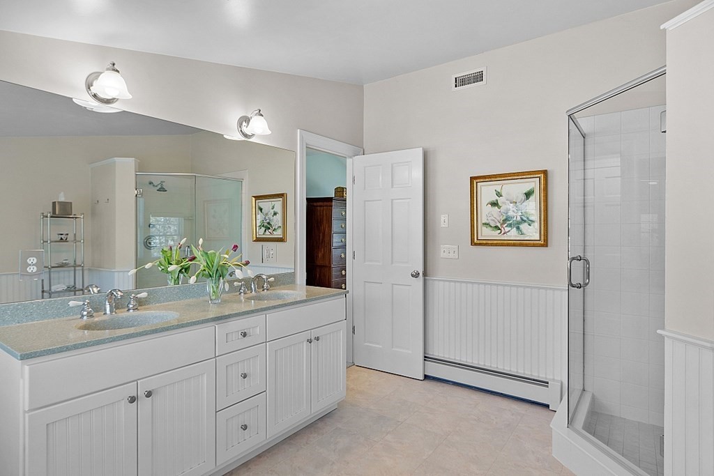 537 Barretts Mill Road Concord, MA 01742 - Photo 21 of 35 a spacious bathroom with a double vanity sink and a mirror