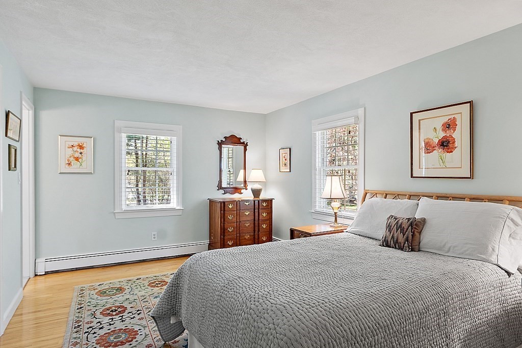 537 Barretts Mill Road Concord, MA 01742 - Photo 22 of 35 a bedroom with a large bed and a window