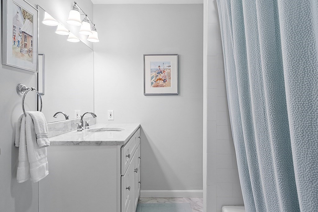 537 Barretts Mill Road Concord, MA 01742 - Photo 25 of 35 a bathroom with a sink vanity and a mirror