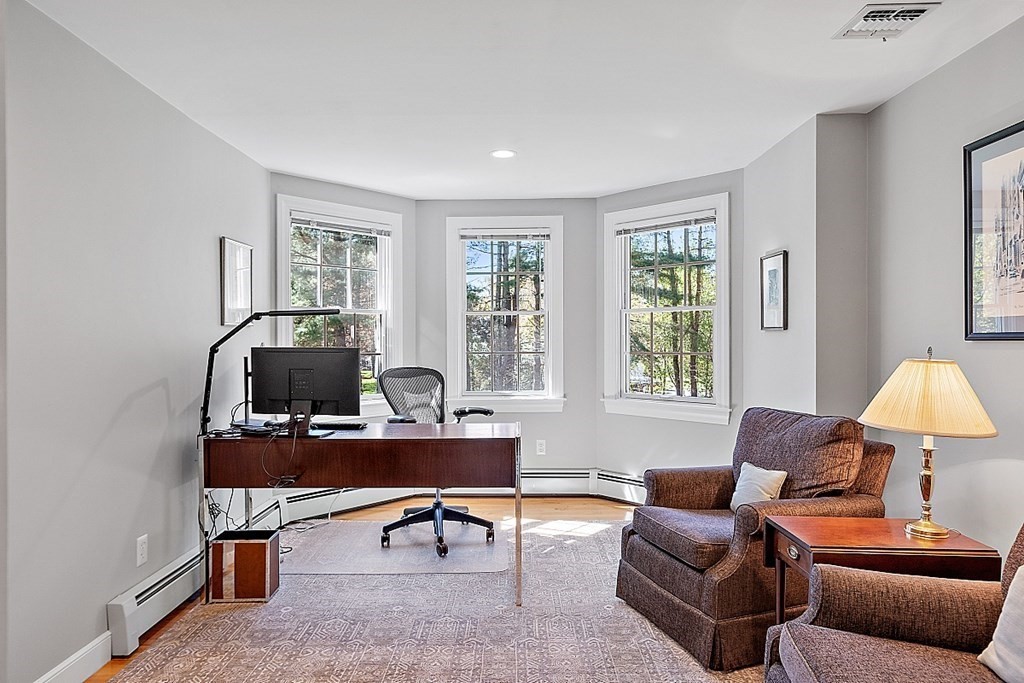 537 Barretts Mill Road Concord, MA 01742 - Photo 26 of 35 a living room with furniture a lamp and a window