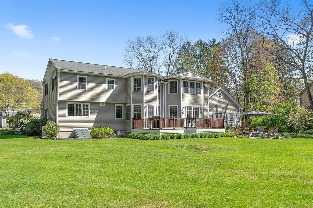 537 Barretts Mill Road Concord, MA 01742 - Photo 28 of 35 a view of a house with a big yard and large trees