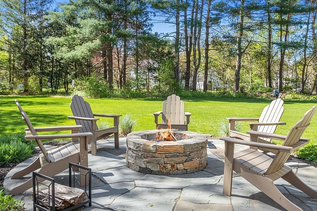 537 Barretts Mill Road Concord, MA 01742 - Photo 3 of 35 a view of a patio with table and chairs and a barbeque