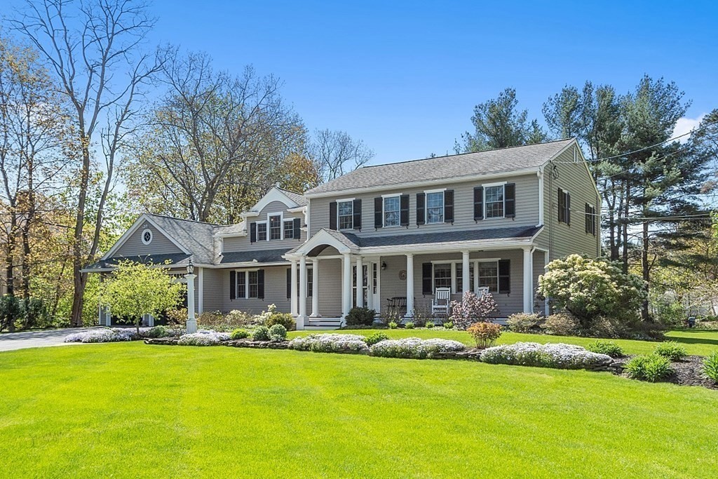 537 Barretts Mill Road Concord, MA 01742 - Photo 35 of 35 a front view of a house with a yard table and chairs
