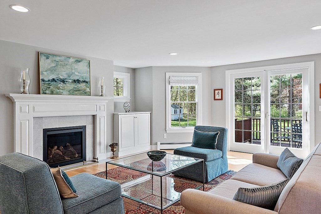 537 Barretts Mill Road Concord, MA 01742 - Photo 6 of 35 a living room with furniture and a fireplace