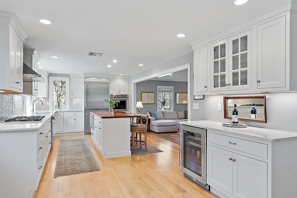 537 Barretts Mill Road Concord, MA 01742 - Photo 8 of 35 a kitchen with a sink and wooden floor