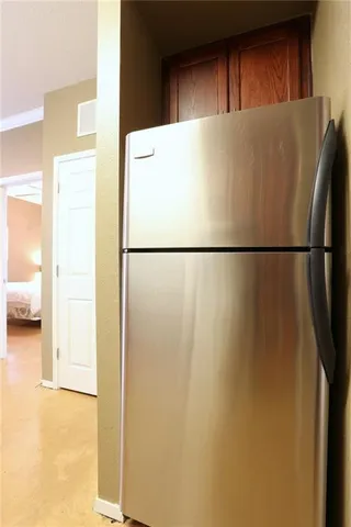 a white refrigerator freezer and a dishwasher sitting inside of a kitchen