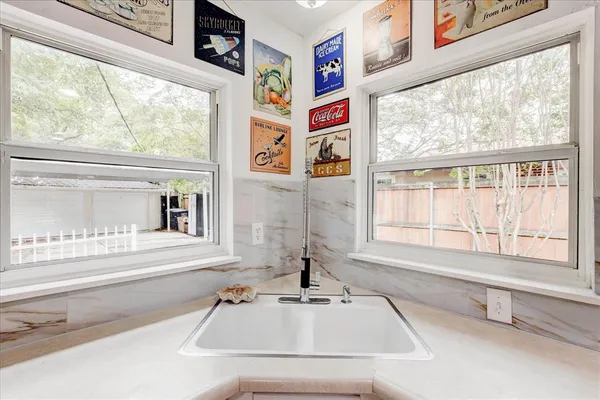 a bathroom with sink and window