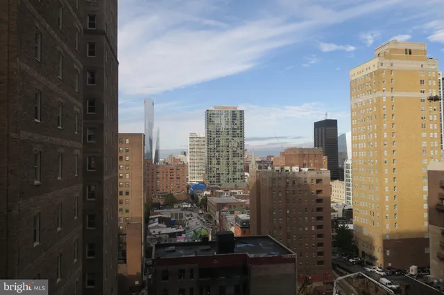 a view of a city with tall buildings