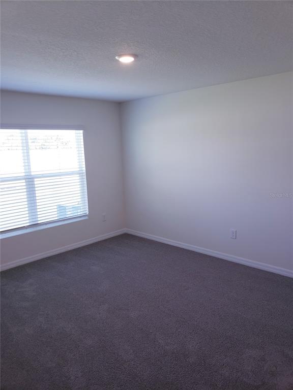 12211 Kingsley Trail Parrish, FL 34219 - Photo 23 of 28 an empty room with a window