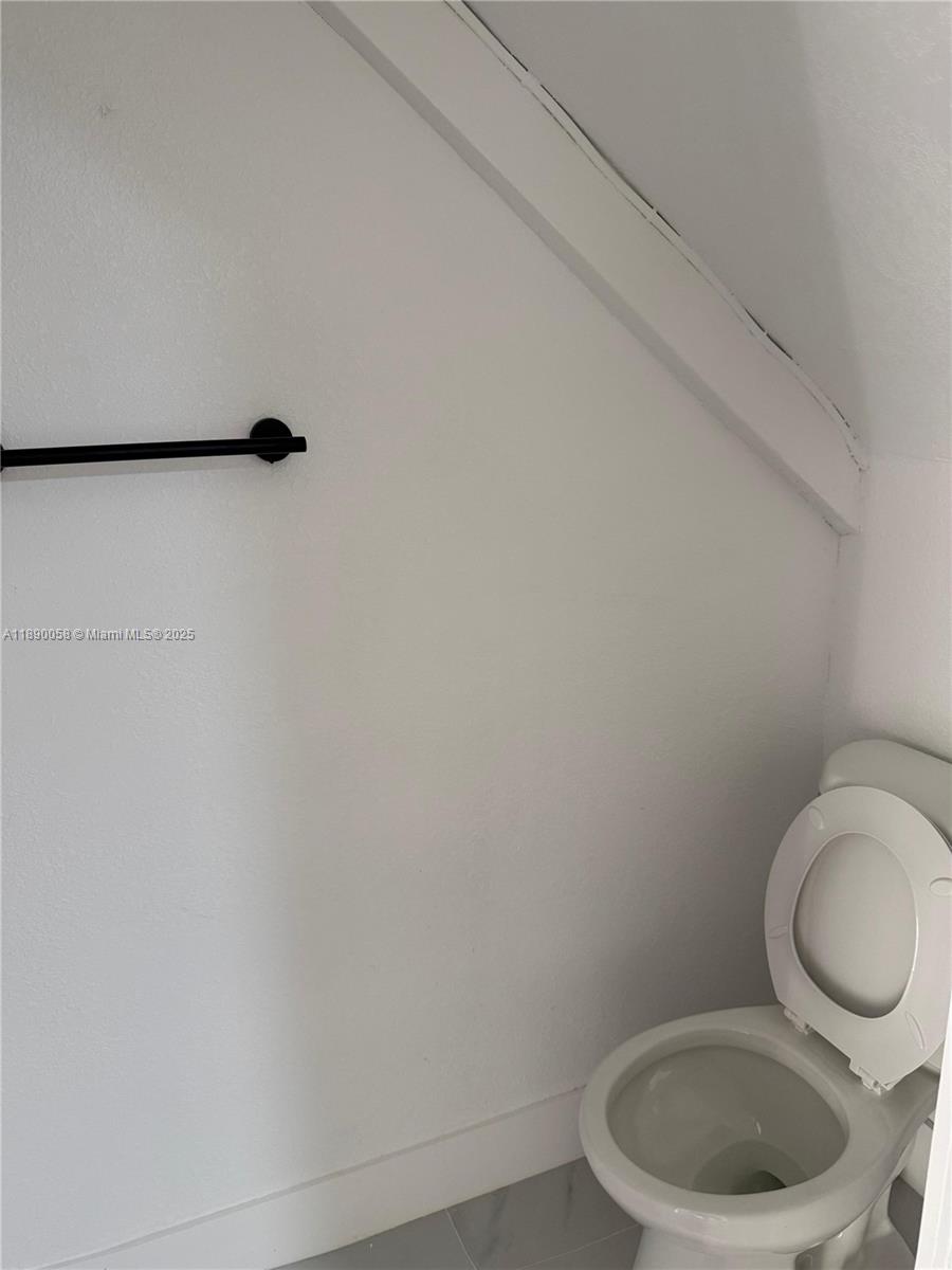 6625 West 4th Avenue, Unit 204 Hialeah, FL 33012 - Photo 11 of 11 a bathroom with a toilet and a sink