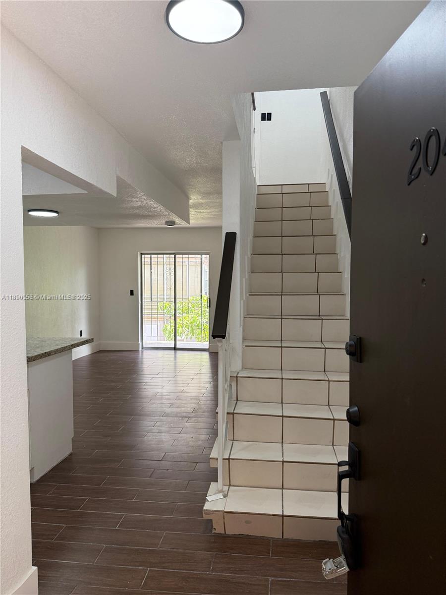 6625 West 4th Avenue, Unit 204 Hialeah, FL 33012 - Photo 2 of 11 a view of entryway with wooden floor