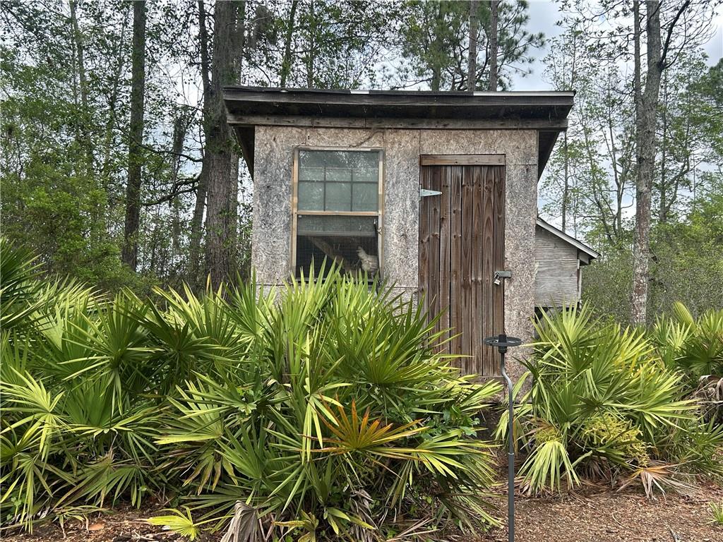 114 Jones Road Hortense, GA 31543 - Photo 24 of 25 a view of a wooden door and trees in front of it