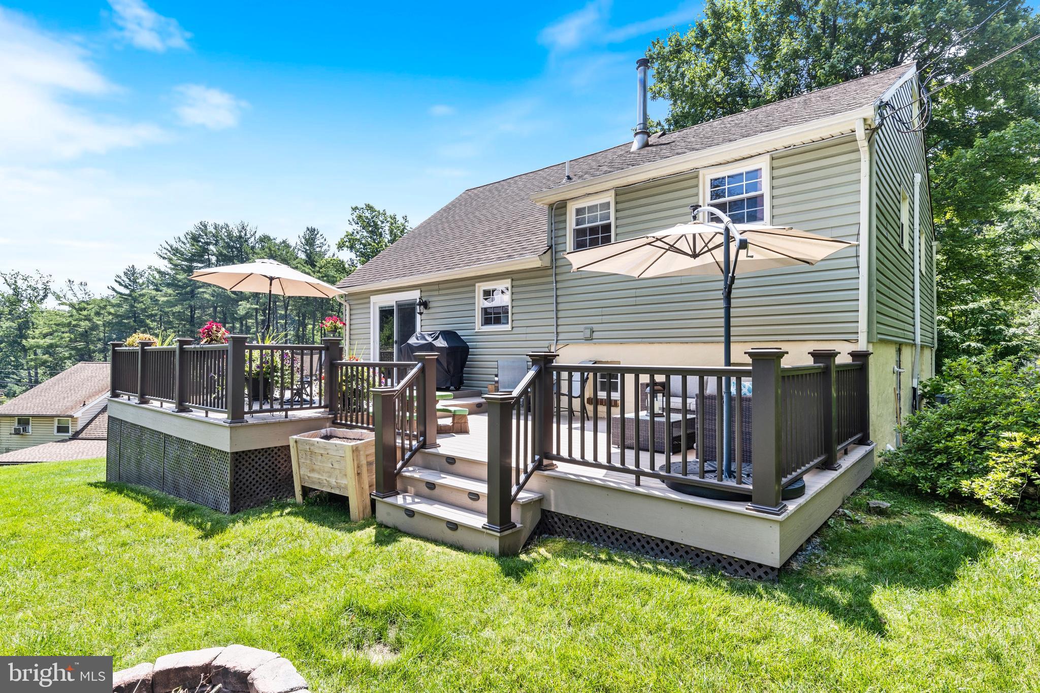 104 Spring Road Malvern, PA 19355 - Photo 6 of 34 Expansive 2-level composite rear deck