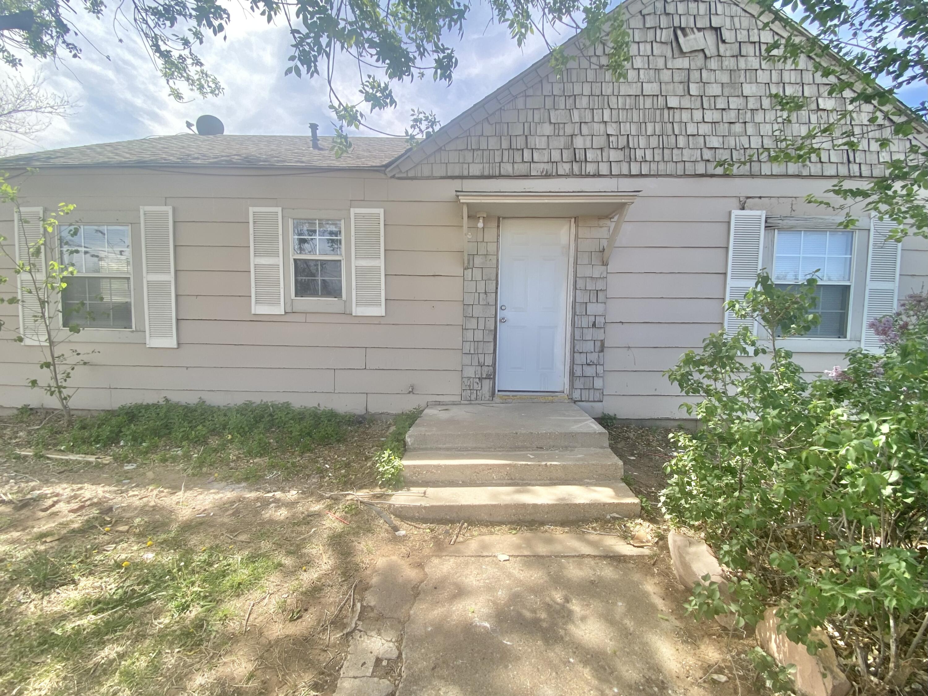 5701 45th Street Lubbock, TX 79414 - Photo 2 of 12 a front view of a house with a yard