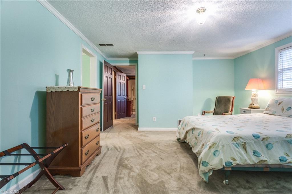 5507 East Rockingham Road Greensboro, NC 27407 - Photo 22 of 29 Bedroom no. 3 located on the second level has its' own ensuite Bath as well.