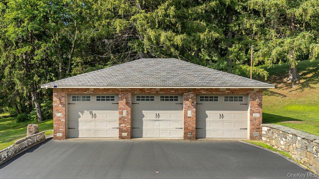 237 Mineral Springs Road Highland Mills, NY 10930 - Photo 31 of 32 a front view of a house with a garden and yard