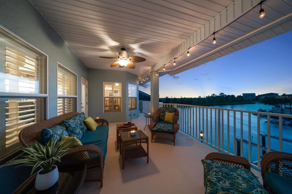 3397 Bluefish Drive Hernando Beach, FL 34607 - Photo 13 of 65 a living room with furniture and a chandelier