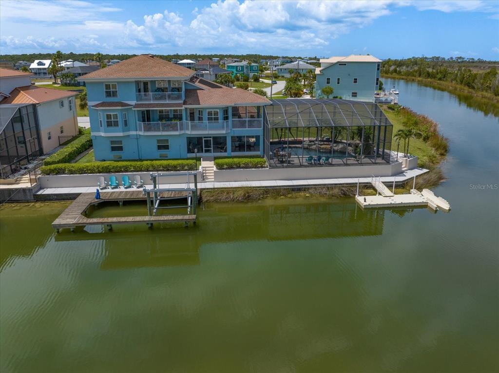 3397 Bluefish Drive Hernando Beach, FL 34607 - Photo 17 of 65 a swimming pool view with a lake view