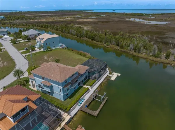 an aerial view of a house with outdoor space